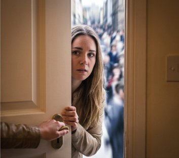 Person with agoraphobia avoiding leaving home, anxiety, treatment